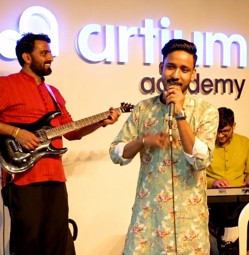 Two colleagues singing into microphones at an office jam session