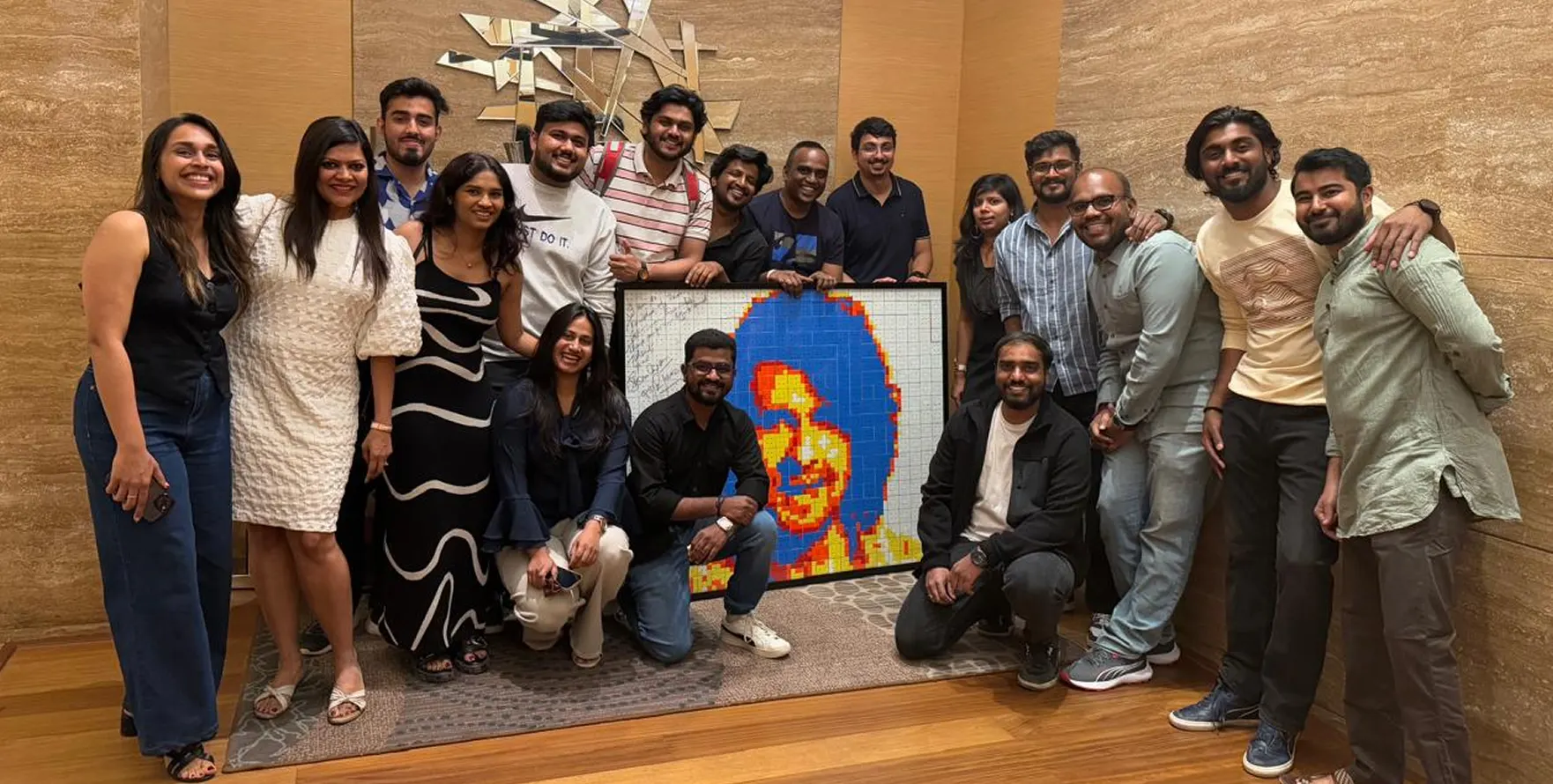The Artium team around a portrait made for Patron in Chief Sonu Nigam